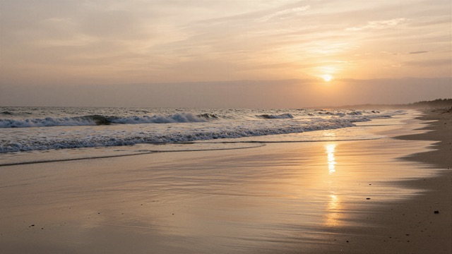 Plage vague couchant
